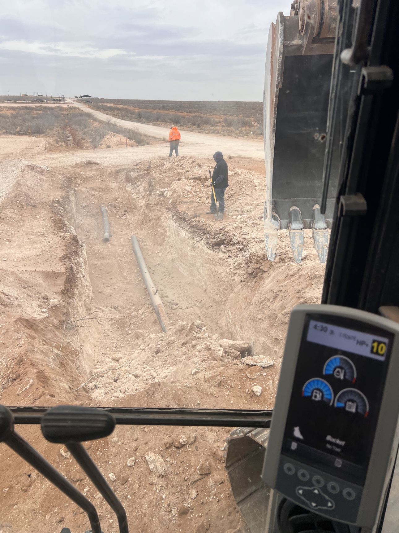 Crew performing trenching work